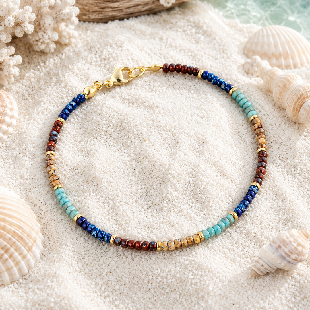 Colourful glass bead anklet in a beach setting