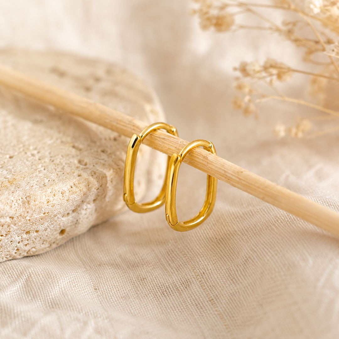 Earrings - gold oval huggies