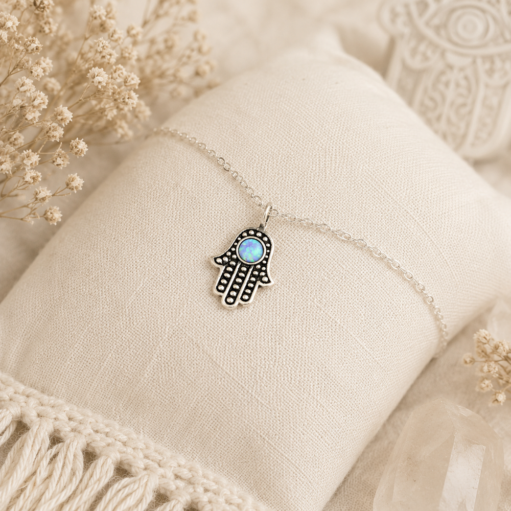Hamsa Hand Anklet in Sterling silver with a blue insert and an extension chain.