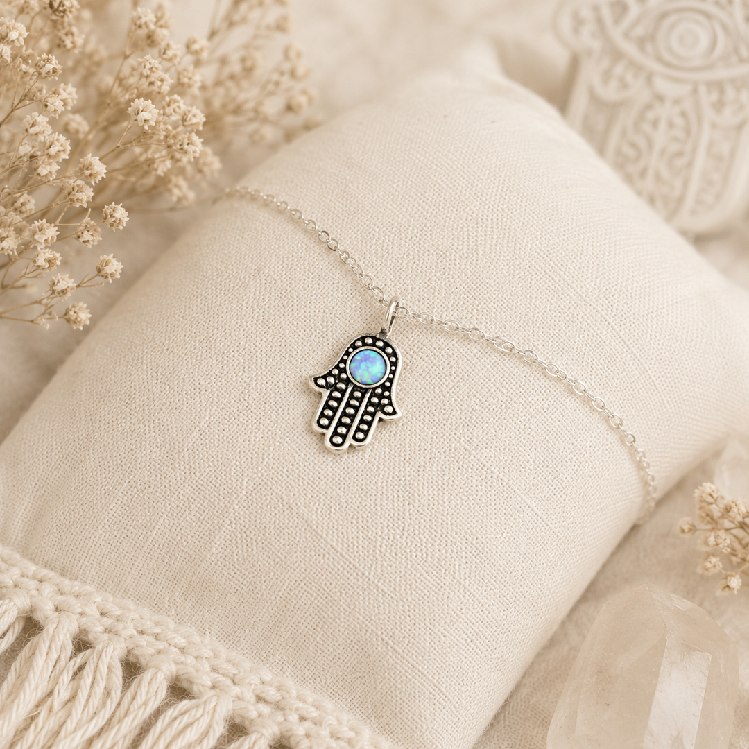 Hamsa Hand Anklet in Sterling silver with a blue insert and an extension chain.