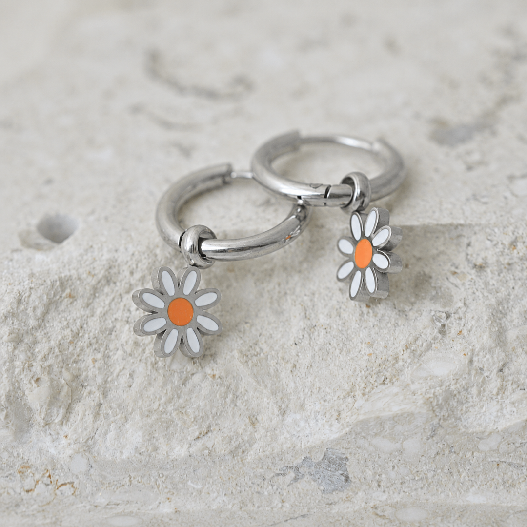 Silver hoop earrings with daisy charms 