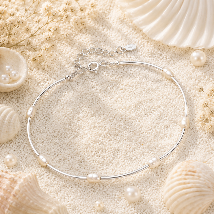 Dainty pearl barcelet with seed pearls and silver tube beads.