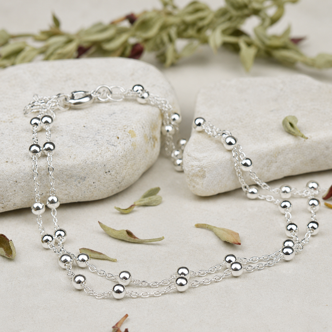 layered sterling silver anklet with chian and balls.
