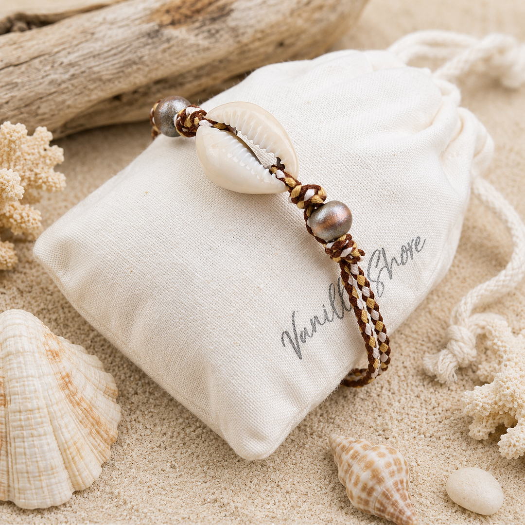 Cowrie shell anklet with brown cord,