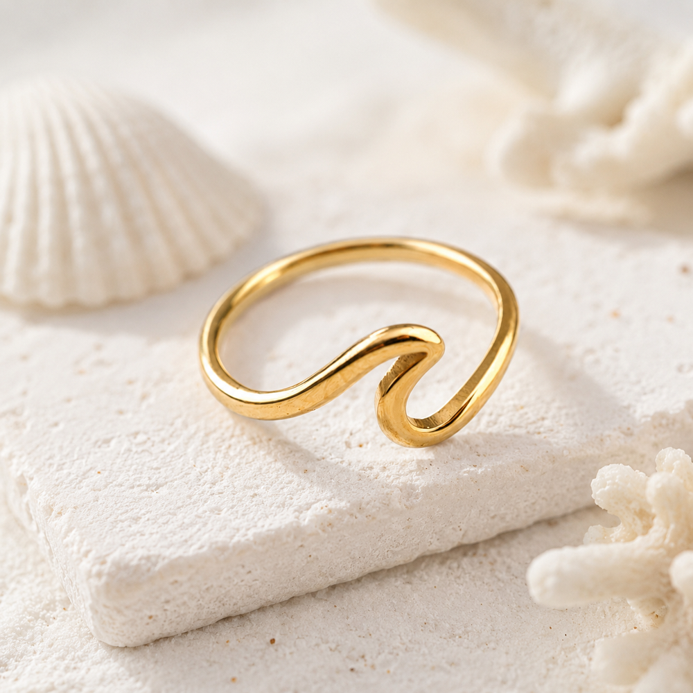 waterproof gold wave ring with a beach inspired setting