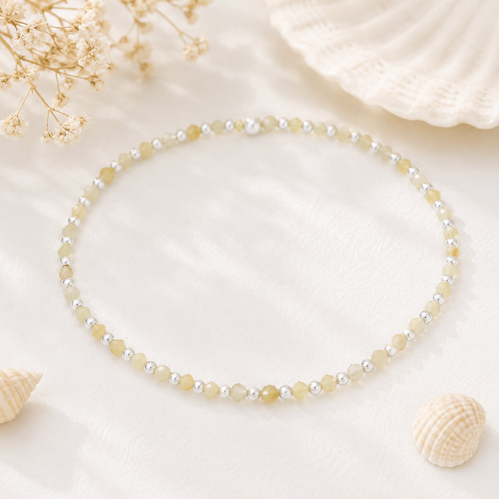 Bracelets - dainty yellow opal strtch bracelet with samll faceted beads between sterling silver beads
